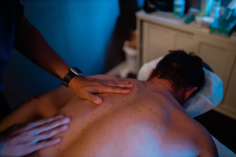 Chiropractic adjustment in progress at a chiropractic practice treatment room